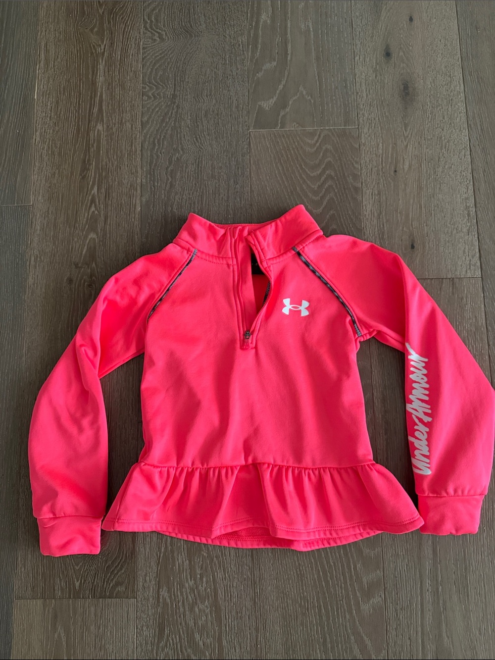 Girls orange Under Armour  sweater. Size:5. Gently Used.